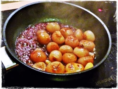 pan of shallots glazing in red wine