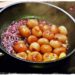 pan of shallots glazing in red wine