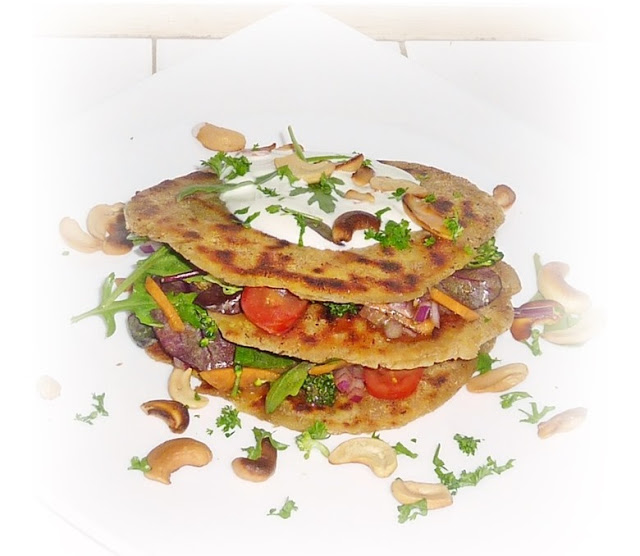 stack of flatbread made from leftover dal with salad