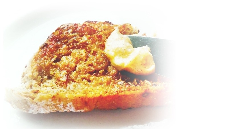 spreading honey cinnamon butter on toast